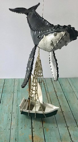 leather humpback with small boat